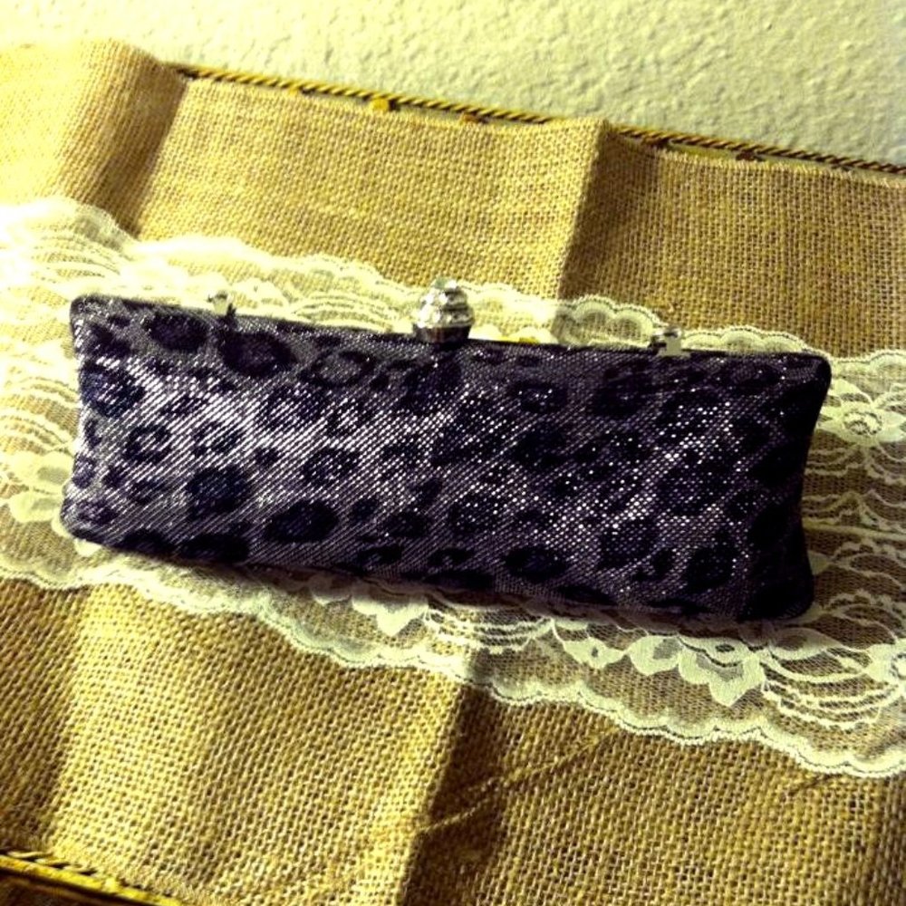 Leopard print clutch with rhinestone knob clasp